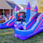 Pink dual bounce house with slide inflatable for kids’ celebrations side view